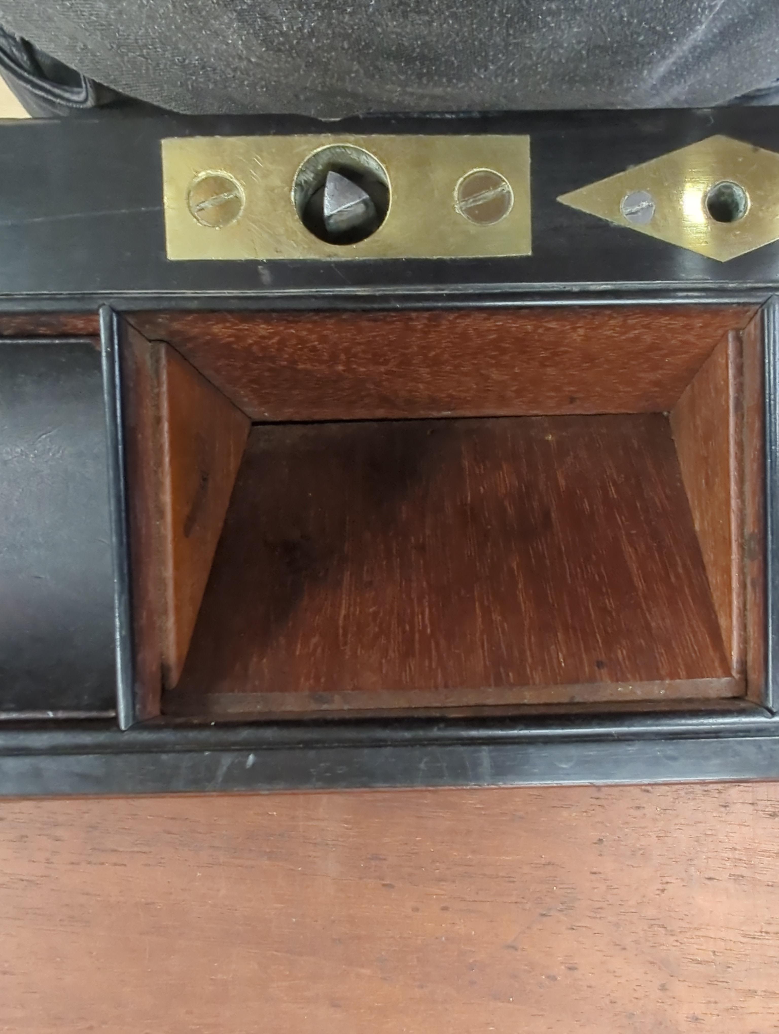 A George III mahogany, ebony and brass-mounted ship's writing box by Wells & Co., screw fixings to each side with original key, 50.5cm x 30cm x 19.5cm